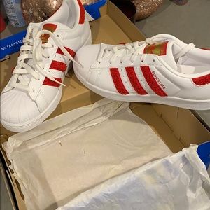 Sneakers. White with red stripe addidas .